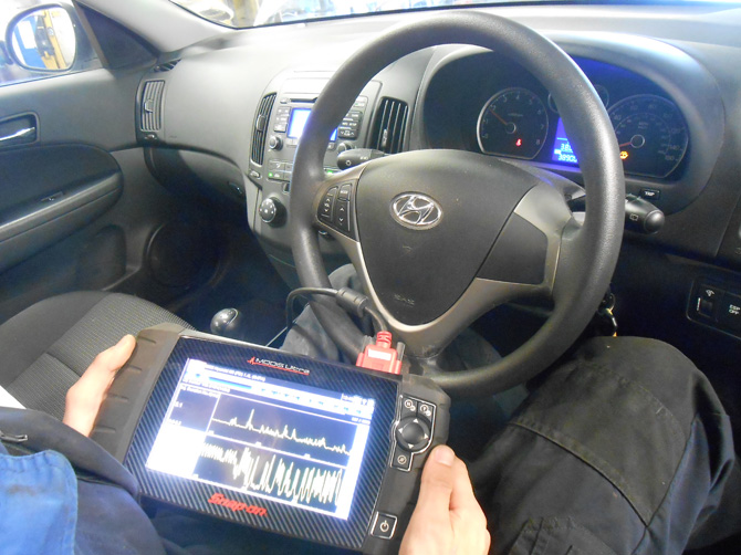 Diagnostic tablet connected inside a Hyundai at Golden Hill Garage